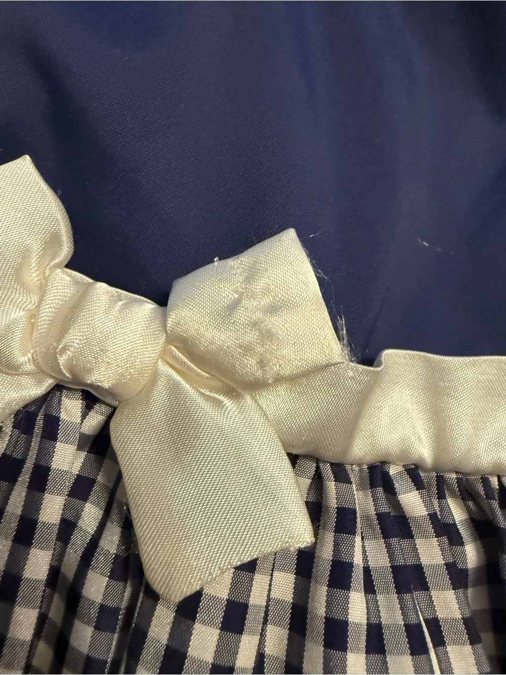 2 American girl doll dresses and 10 wood doll hangers.